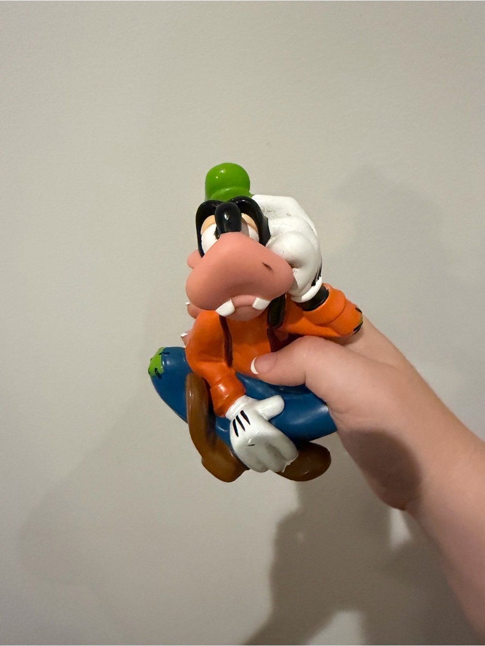 Disney Goofy Figure in Orange Outfit with Blue Accessory and Green Hat